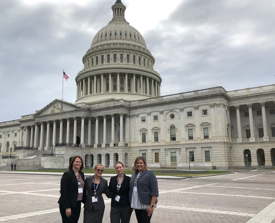 Students and Advisors standing in front of the Capital Building